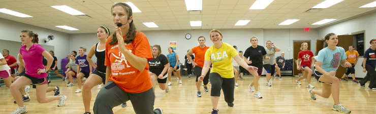 students in a group exercise class
