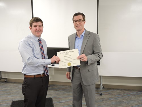 Andy James inducted into Omicron Delta Epsilon
