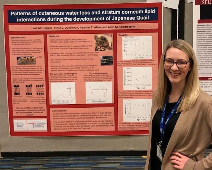 USI Biology Student Livia Hopper presenting her research poster at a scientific conference