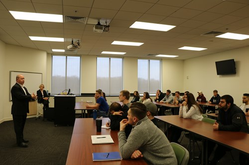 Congressman Larry Bucshon visits USI Romain College marketing class