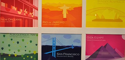 Illustrations of various key tourist attractions, displaying name of city within artwork (e.g. Giza Egypt with illustration of pyramids). Each is created in bright monotone colors - Kristen Huff, Colors of Travel