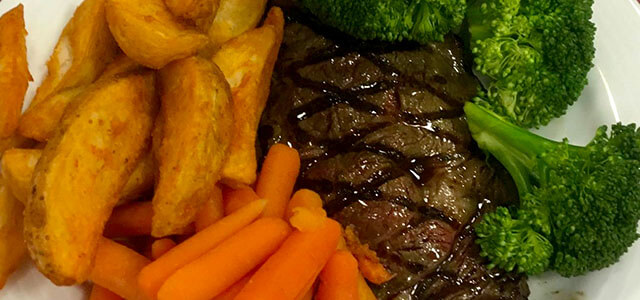 Plate of food with steak, carrots, brocolli, potatoes