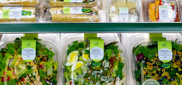 refrigerated area at Simply to Go where there are packaged salads, sandwiches, and various other cold snacks