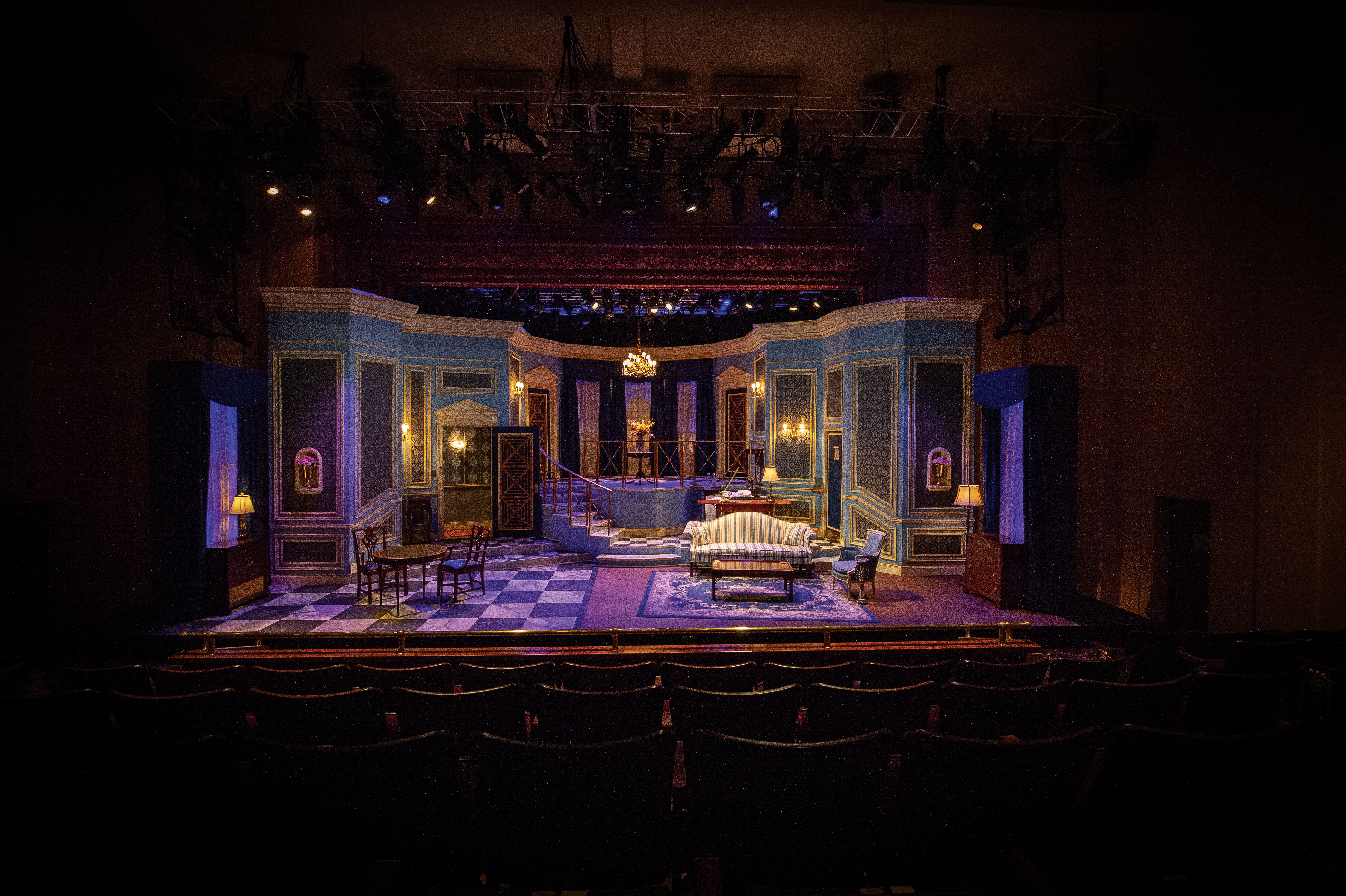 Stage set with props that make it look like the inside of a house 