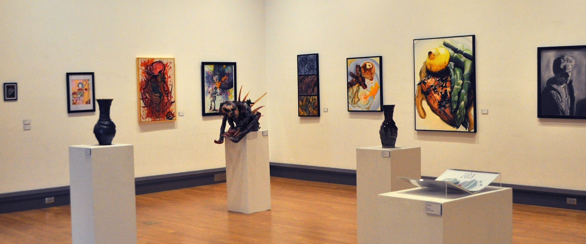 Various 2D, sculpture items on display in McCutchan gallery