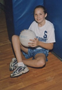 Sara Beth Vaughn as a child with a volleyball