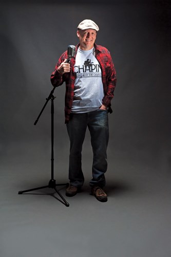 Scott Sallman standing with a mic