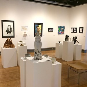 Shot of gallery showing paintings, drawings, ceramics, sculpture