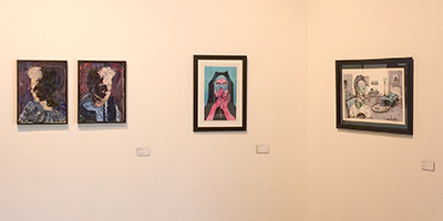 Picture of paintings, drawing hanging on wall on display in gallery