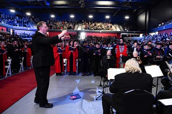 Daniel Craig, associate professor of music, directs the USI Chamber Choir during the Inauguration of President Ronald S. Rochon