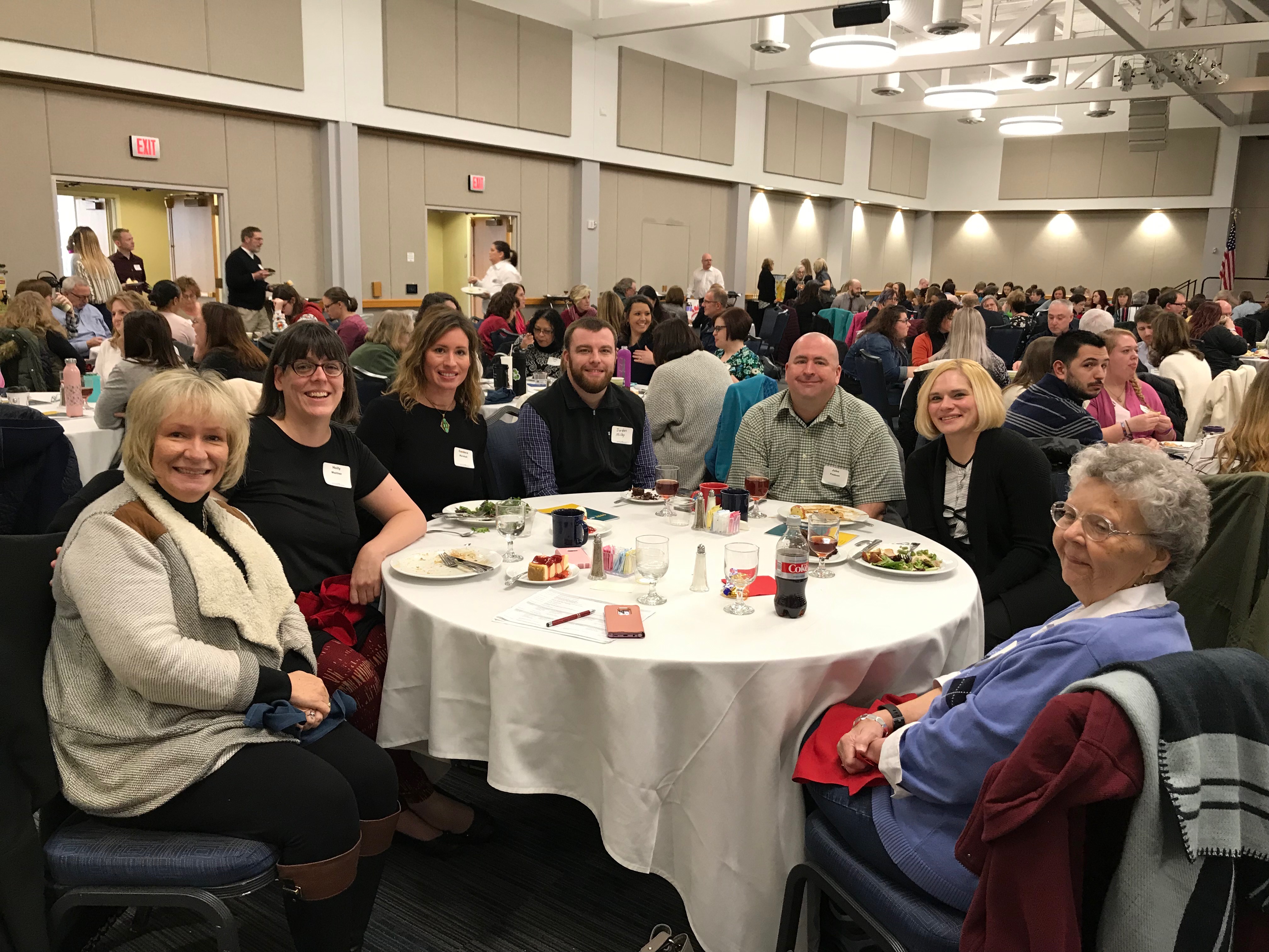 Table of people at the 14th Annual Social Work Conference at USI