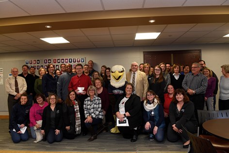 Jeff Sickman poses with colleagues, President Rochon and Archie after being surprised with USI's third annual Screagle Pride Award