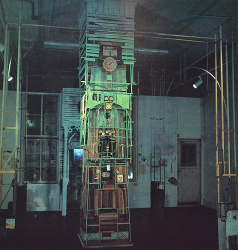 installation shot of a haphazardly constructed clock tower