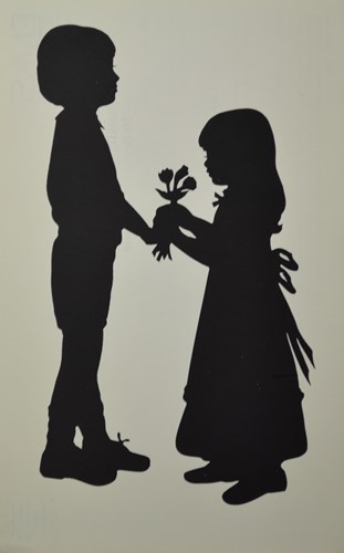 silhouette of children holding flowers