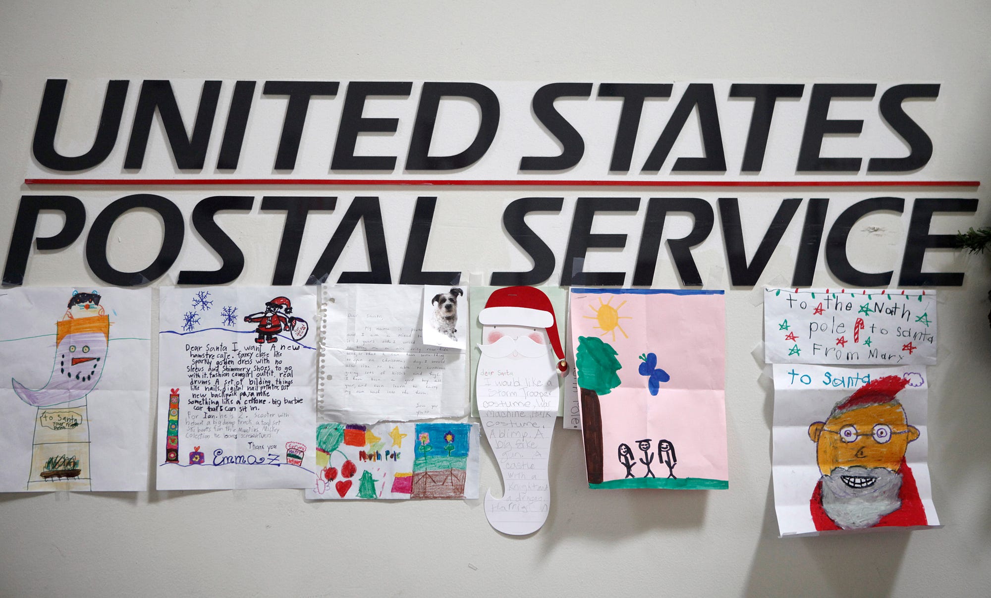 USPS logo and children's letters to Santa