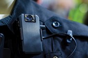 policeman's shoulder with body camera