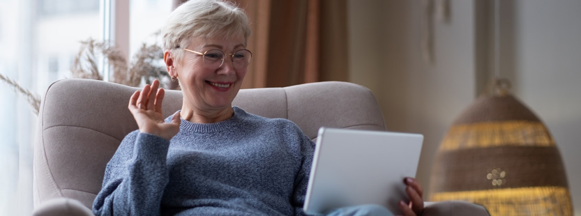 Older woman looking at a tablet