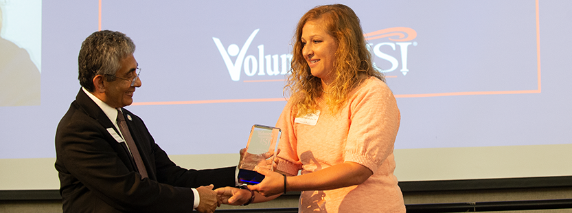 photo of a woman receiving an award