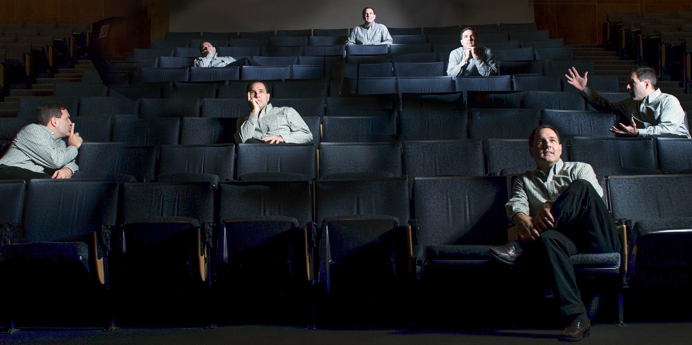 Composite picture of man in different poses in theater seats